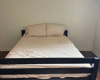 Black Metal Bed Frame with Striped Bedding