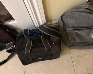 Assorted duffle and back packs.  Bags