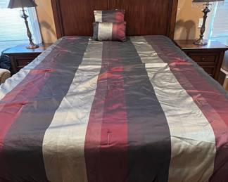 Queen bed with matching end tables  bed has draw in it on bottom 