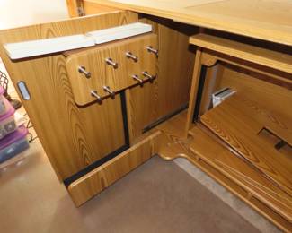 Koala sewing station with multy changing options, drawrs, shelves, power, cutting tables, sewing machine storage.