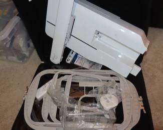 Brother Innovis XV8550D digital embroidery machine with hoops and frames and multiple Floratine embroidery CDs.