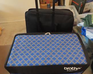 Brother Innovis XV8550D digital embroidery machine with hoops and frames and multiple Floratine embroidery CDs.