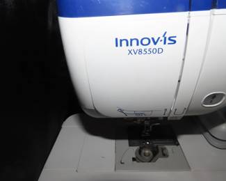 Brother Innovis XV8550D digital embroidery machine with hoops and frames and multiple Floratine embroidery CDs.