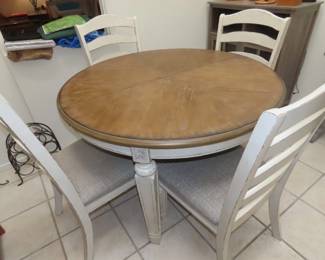 Dining table/6 chairs and extra leaf.