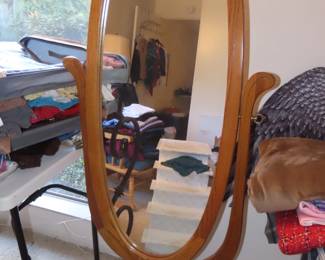 Swivel mirror on wooden stand.