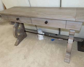 Matching sofa/library table with drawers.