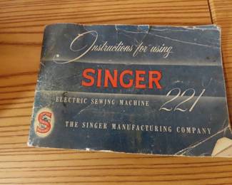 Like new Singer 221 electric sewing machine and case.