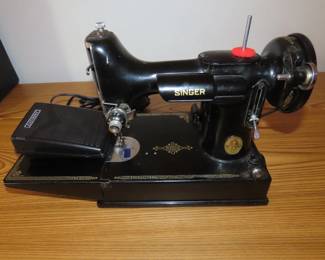 Like new Singer 221 electric sewing machine and case.