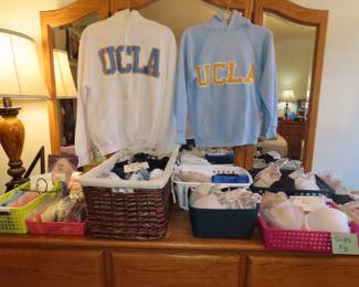 baskets of clthing and UCLA sweatshirts.