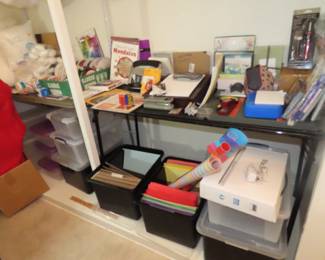 Filing containers, art paper, office supplies, coloring books, paper cutters, desk supplies.