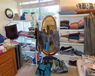 Sweaters, tee shirts, mirror, blankets, clothing stirage bags.