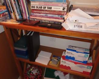 office supplies, folding bookcase and sewing/quilting books.