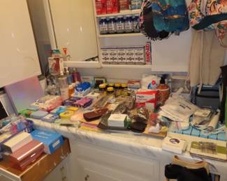 Personal hygiene items, new bottles of vitamins and supplements.