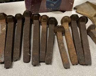 Collection of railroad spikes, a cobblers molded and a few other items