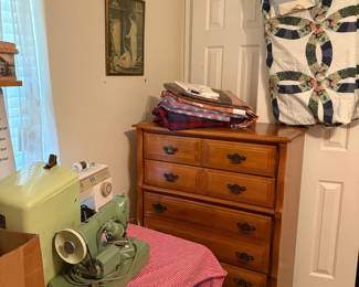 chest of drawers, sewing machines, comforter
