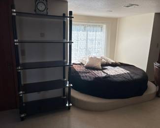 round bed, black lacquer shelf