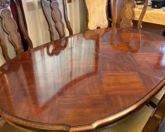 dining table has 2 additional leaves, 8 chairs