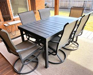 Outdoor expandable metal table with 8 chairs (only 6 chairs showing)