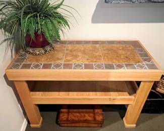 Quality tile and wood table (we have the matching lamp tables)
