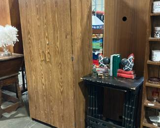 Laminate storage cabinet filled with puzzles, 