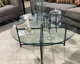 Round glass top coffee table with iron base