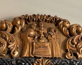 Ornate Giltwood and Black Baroque Mirror with Cherub and Figural Relief