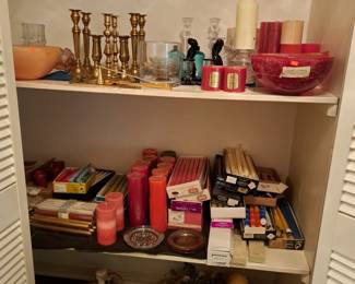 Many candles and candle sticks