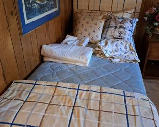 Twin bed with all the linens, sailboat picture 