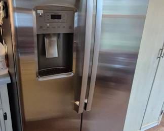 Two months NEW side by side refrigerator with ice maker $1000 Firm. Everything else in estate sale is 75% off. 