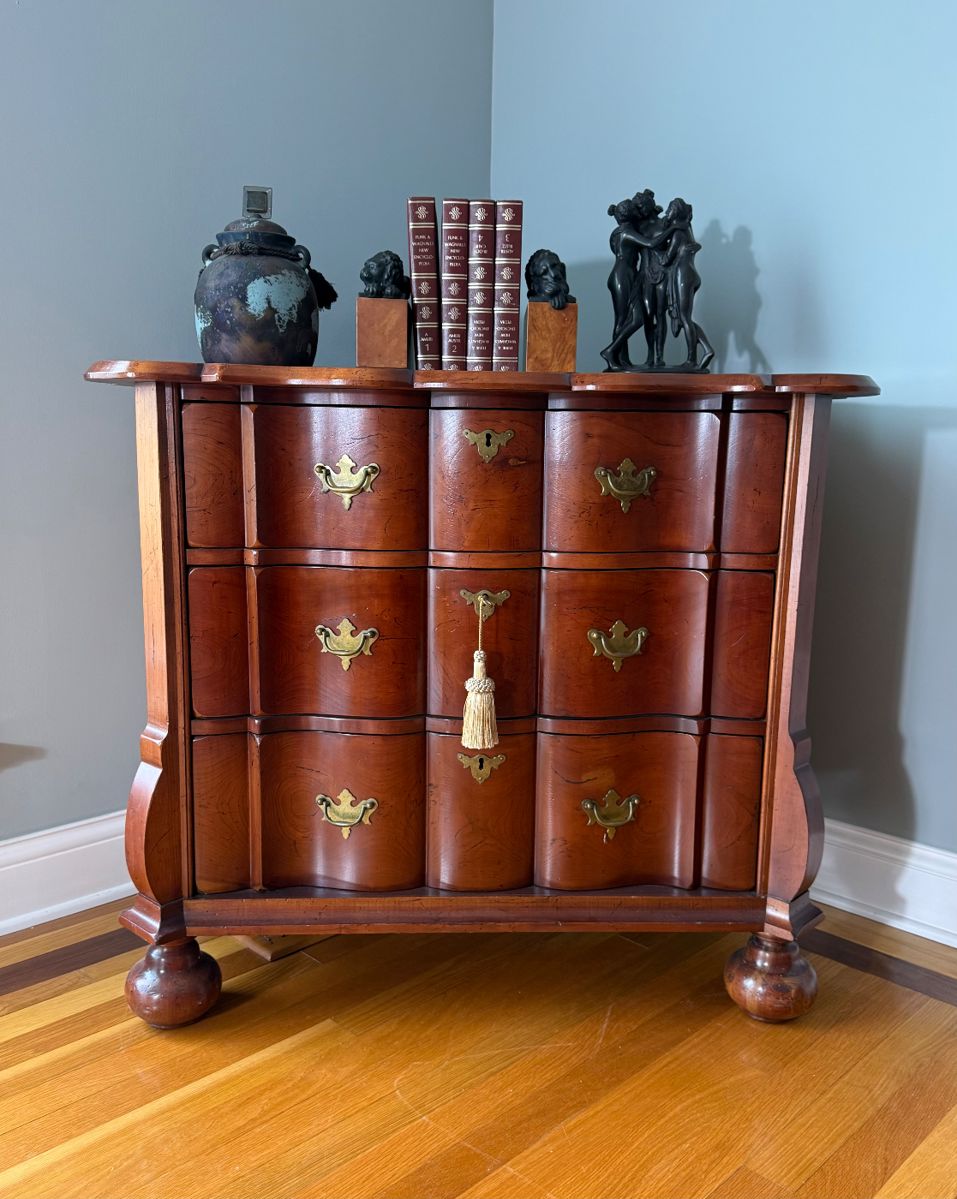 Elegant vintage bombé chest of drawers featuring serpentine front.  Perfect as an entry chest, accent cabinet, or statement storage piece blending beautifully with both modern and traditional interiors.

Bombé chest, serpentine dresser, vintage chest of drawers, traditional furniture, brass hardware, curved front chest, statement storage, entryway chest, accent cabinet, classic wood furniture, traditional décor, colonial revival, Georgian style, antique style dresser, estate furniture, luxury accent piece, timeless design, warm wood case piece.I 

