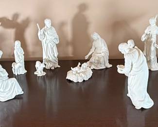 Large Lenox porcelain nativity set featuring finely detailed hand-sculpted figures in classic ivory bisque. Includes Holy Family, angels, shepherds, wise men, and animals. Elegant holiday centerpiece with timeless craftsmanship, perfect for seasonal display or collectors of Lenox Christmas décor.