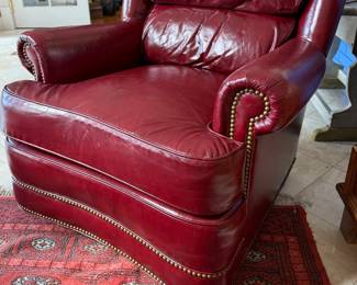 Pair of Whittemore-Sherrill Limited red leather club chair featuring classic rolled arms, brass nailhead trim, and deep cushioned comfort. High-quality American craftsmanship with timeless traditional style. Whittemore Sherrill, leather club chair, red leather chair, nailhead trim, traditional furniture, luxury seating, American made furniture, accent chair, library chair, study chair, classic design, high end furniture, estate furniture, vintage leather, designer seating, lounge chair, upscale décor, quality upholstery, living room chair, heirloom furniture, collectible furniture, estate sale find, traditional décor, comfortable armchair.