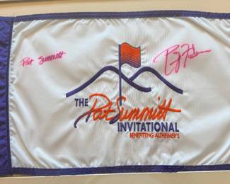 Rare commemorative Pat Summitt Invitational golf flag, personally signed by legendary University of Tennessee Lady Vols basketball coach Pat Summitt and former University of Tennessee head football coach Phillip Fulmer. Created for The Pat Summitt Invitational Benefiting Alzheimer’s, this piece represents an important charitable event honoring Coach Summitt’s enduring legacy and her advocacy for Alzheimer’s awareness.
