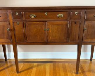 Beautiful solid wood huntboard / sideboard crafted by Craftique of Mebane, North Carolina, known for fine traditional American furniture. Features multiple drawers, cabinet storage, original brass hardware, and elegant tapered legs. Warm finish with excellent craftsmanship—ideal as a dining server, huntboard, or entry console. Classic Southern design perfect for traditional interiors and collectors.