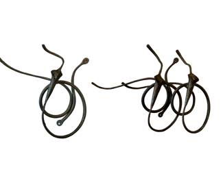 Pair of J. Brubaker (Indiana artist) Lilly form wrought iron wall mount candleabra