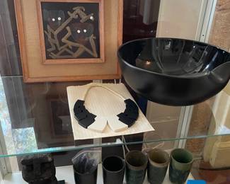 Puerto Rico Pottery cups, lava rock statue, Tiffany & Co. bowl, Guillemette L 'Hoir Galalith necklace, Harris Strong art tile