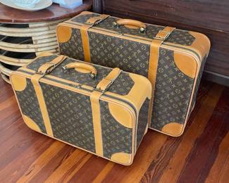 pair of Louis Vuitton monogram luggage