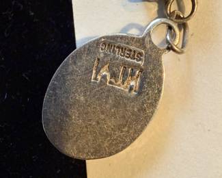 Charming sterling earrings with green stones marked