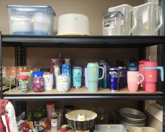 Plastic storage, travel mugs (many in like new condition), bakeware, and other gadets