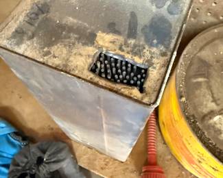 Large container of welding rods.