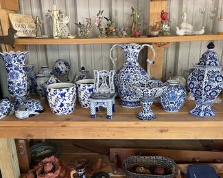 Decorative blue and white ceramic vases, ginger jars, candle stakes, bowl, cat, and rabbit 
