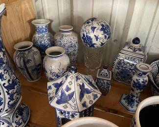 Blue and white ceramic bird house, balls, and vases 