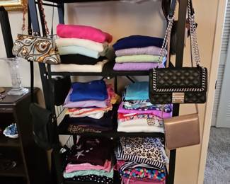 Assorted Women's Handbags and Folded Clothing
