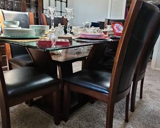 Modern Glass Top Dining Table with Dark Wood Base and Chairs