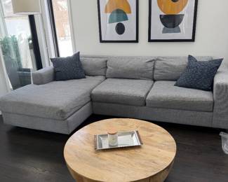 West Elm sectional sofa; natural wood drum coffee table