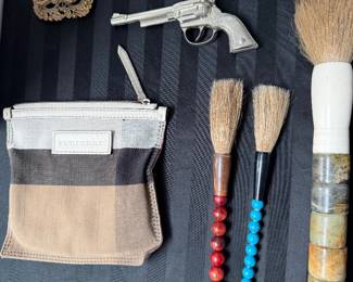 vintage Chinese calligraphy brushes; vintage cap guns; Burberry purse