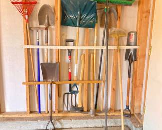 - Set of Essential Landscape Tools Featuring Shovels, Rakes, Forks, and Pry Bars