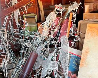 This is a pile of out door Christmas decorations, a sleigh is in there too.