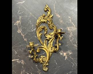 MCM Hollywood Revival cast wall candelabra. Very heavy. Measures 18 1/2 inches tall by approximately 11 inches wide. Holds two taper candles.