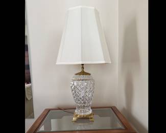 Very heavy glass table lamp. Possibly Waterford Crystal. Square brass base. Measures 30 inches tall. Very nice condition.